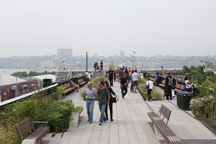 Visitors walk along the recently opened section of the High Line on Sunday afternoon.