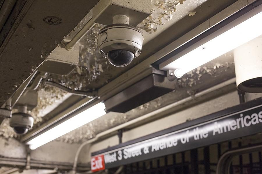Rows of surveillance cameras line the ceiling at the West Fourth
street MTA station.