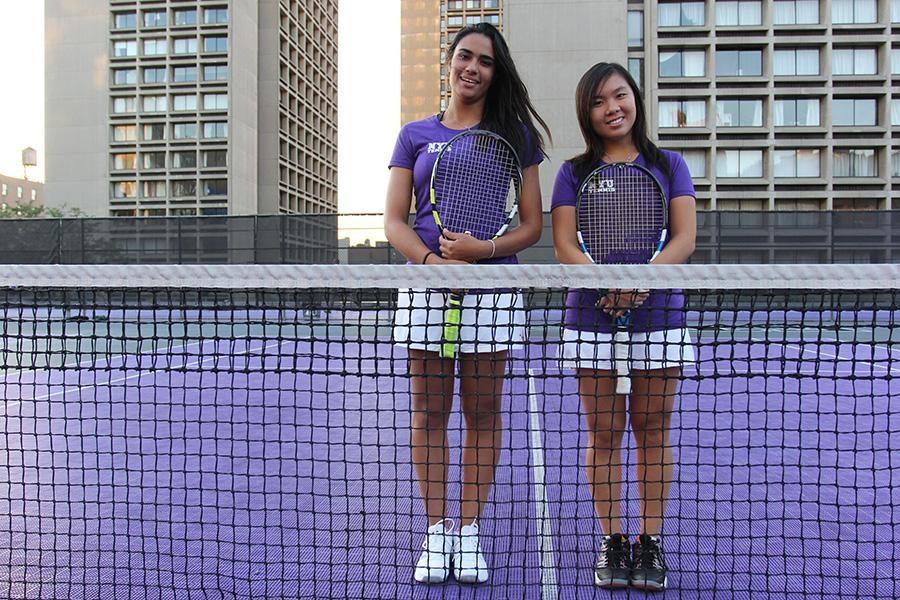 Laila El Dessouki (left) and Carmen Lai (right) stand on the tennis court. 
