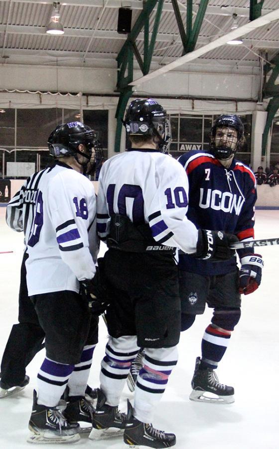NYU forwards Mike Cambria, 18, and Dakota Richardson, 10, exchange words with UConn defender Christian Neumann during Fridays match at Chelsea Piers.