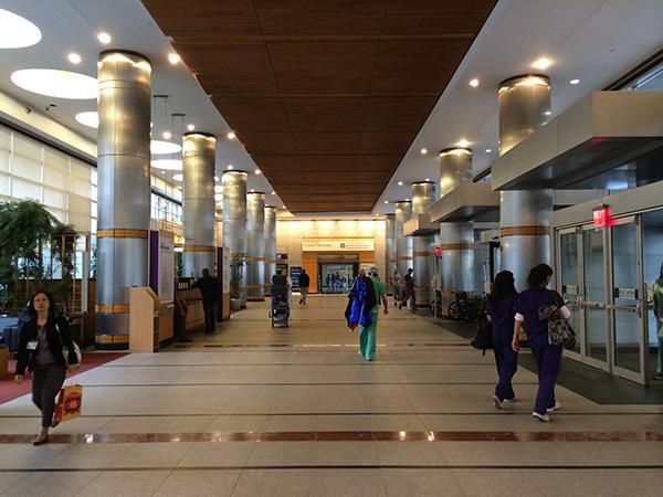 Employees walk in Langone Medical Center. 