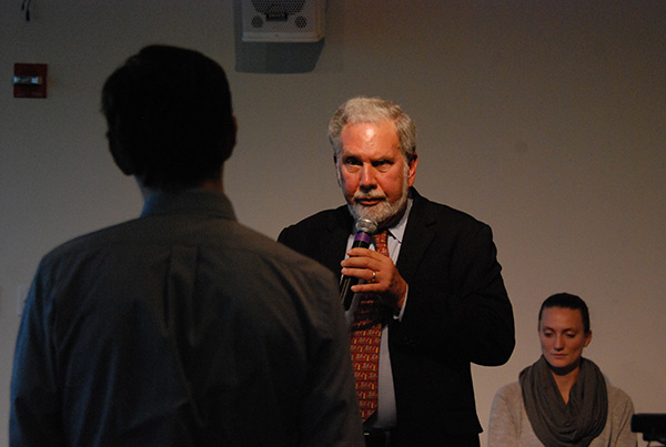 NYU President John Sexton addresses a student at the town hall on Oct. 1.