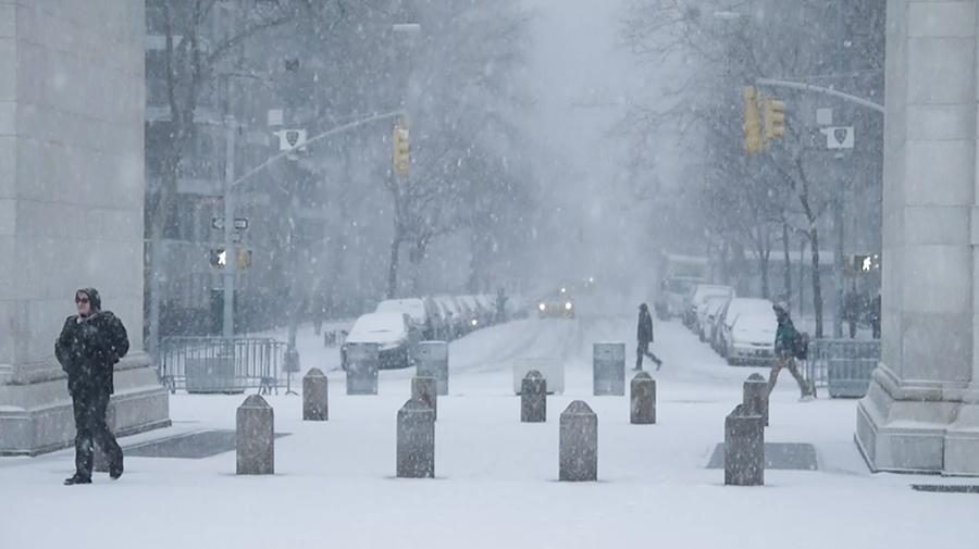 Winter storm Juno falls on Washington Square Park.