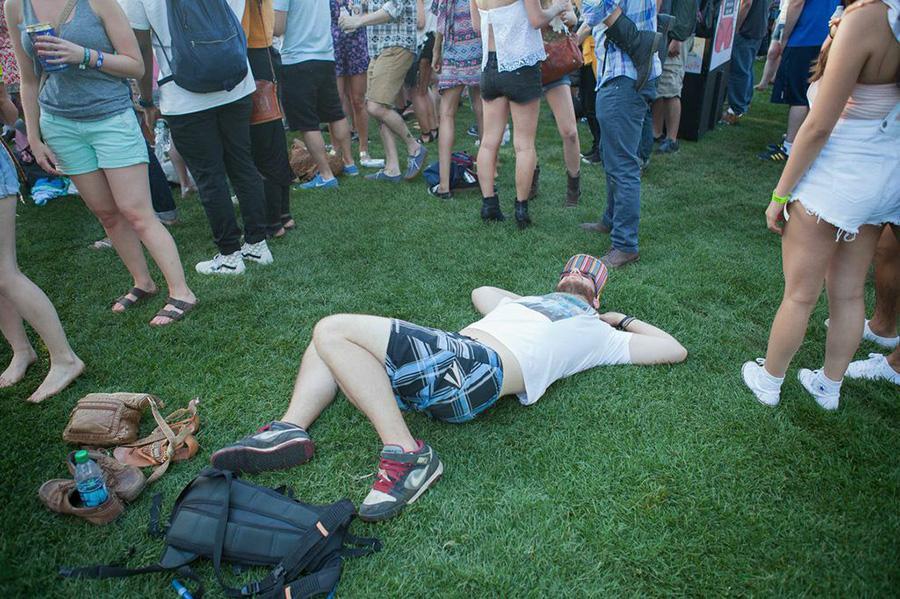 A fan rests among the crowd at Governors Ball 2014