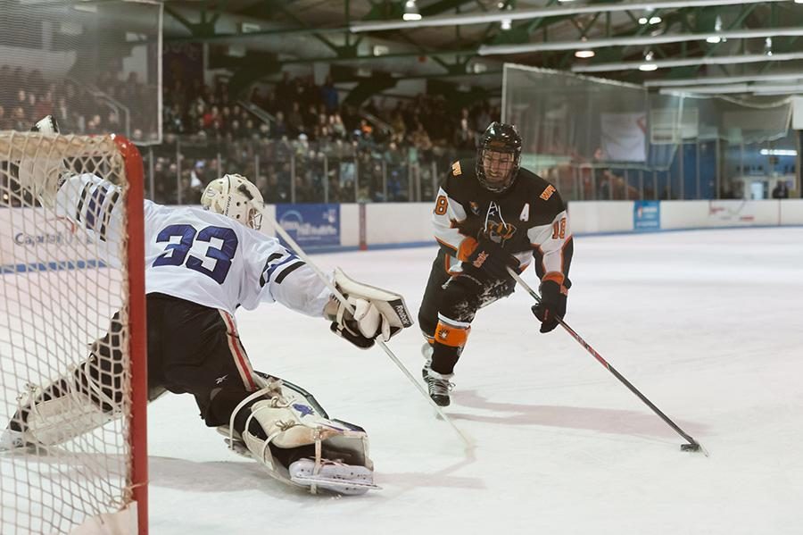 William Patterson forward Richard Pallai, right, attempts a shootout on NYU goaltender Jack Nebe. Nebe made the stop against Pallai, a former Violet who led NYU in points in 2012-2013.