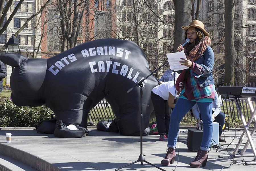 Poet Queen GodIs emcees an anti-street harassment rally in Washington Square Park on Saturday.