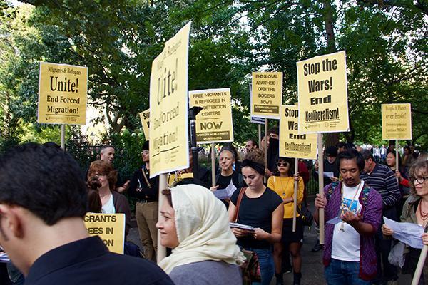 Rally in Washington Square Park demands for the UN to open borders and provide safety for migrants.