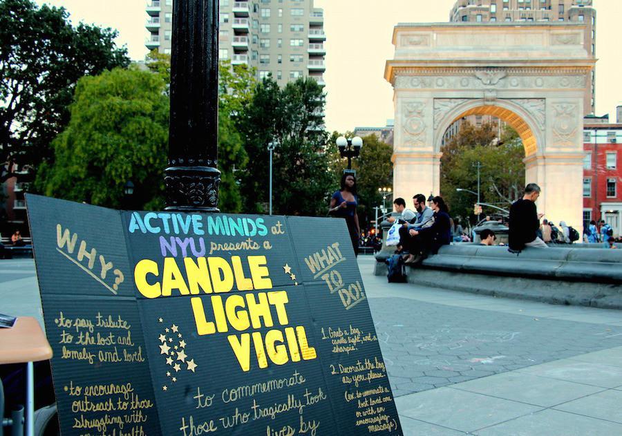 NYU Active Minds set up a poster in Washington Square Park as part of a vigil for those who have committed suicide.