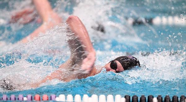 Max Phillips finished first in the 200-yard freestyle helping the Violets Defeat Cortland in their season opener.