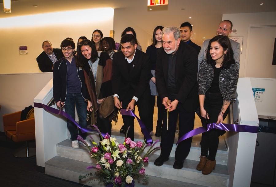 John Sexton along with members of the Commuter Student Council cut the ribbon to Hayden Halls new commuter den. 