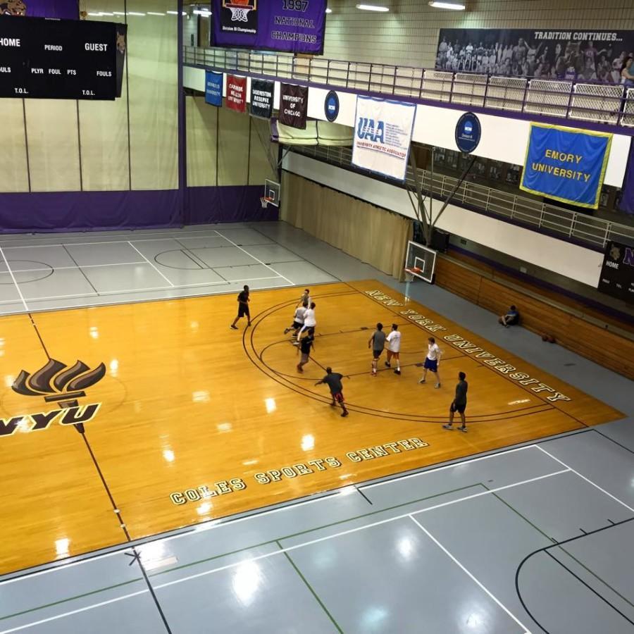 NYU students participate in a pickup basketball game at Coles Athletic Center.  