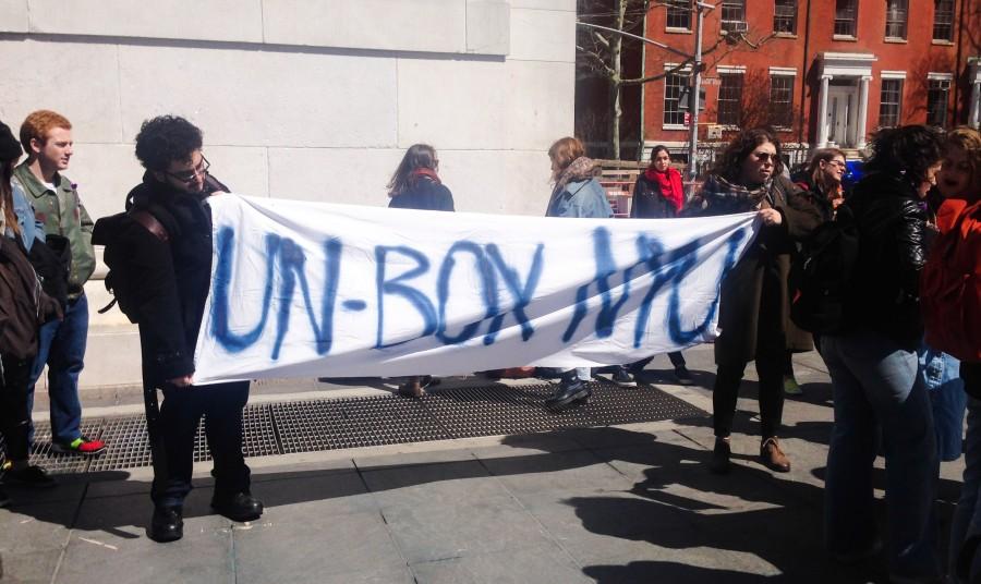 NYU students rally to ban the box underneath the Washington Square Park arch. 