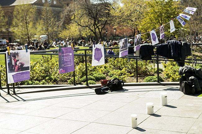 During the rally in Washington Square Park on April 16, CAS professor Colette Mazzucelli and her students created an installation of placards and candles.