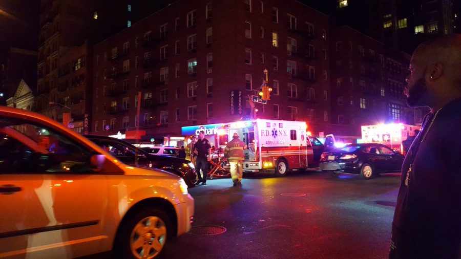 Emergency vehicles respond to an explosion in Chelsea, shutting down the surrounding two-block area.