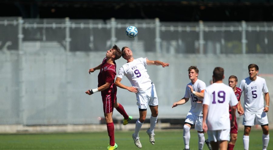 Junior Nic Notaro, who plays forward, goes in for a header against Mt. St. Vincent.