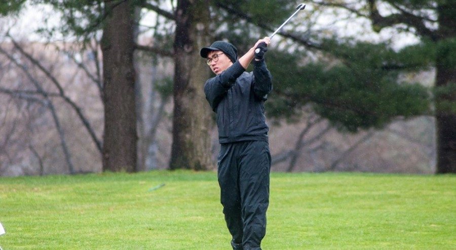 Qizhi Wong, sophomore golfer, mutters “come on Cheech” as part of his pre-shot routine.