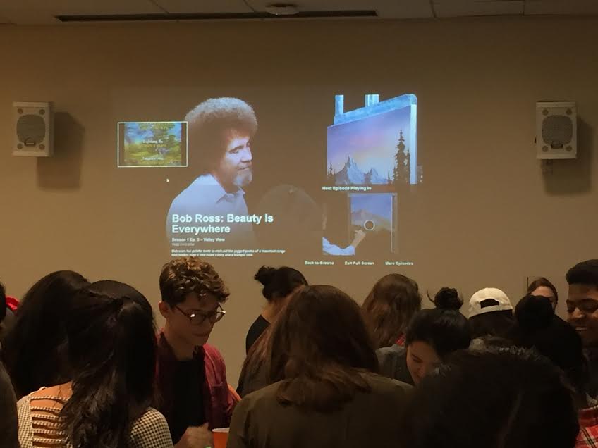 Attendees painted as Bob Ross videos played in the background.