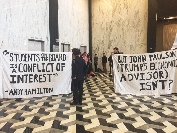 Protesters gathered at Schwartz Plaza today to demonstrate in favor of the recent SSC vote and an NYU Board of Trustees members connection to President Donald Trump. At one point, protesters were positioned in front of the elevator that goes  to President Andrew Hamiltons office. 