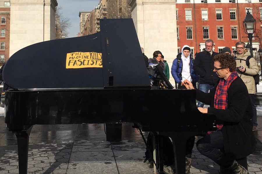A pianist who frequents Washington Square Park altered his instrument with a sign that reads this machine kills fascism. He played in front of the arch as people gathered to record his music.