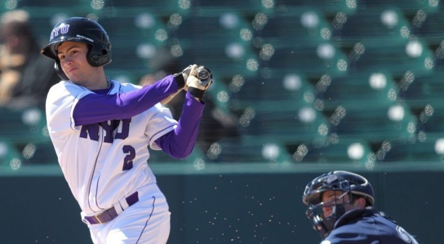 Jonathan Iaione bats against the University of Wisconsin-Stout, March 12. The NYU baseball team won this game and three others of seven In Fort Myers over spring break.