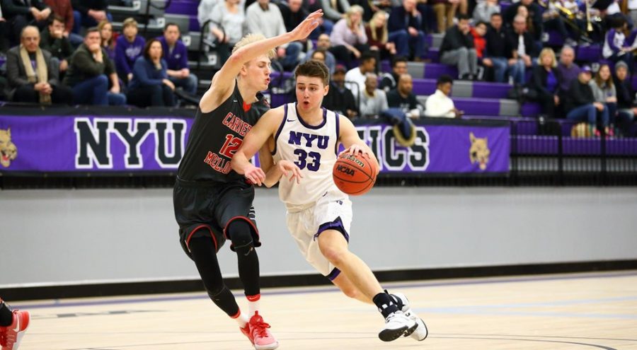 Jimmy Martinelli defends against the University of Rochester, Jan. 27. Martinelli was recently named Rookie of the Year by the UAA.