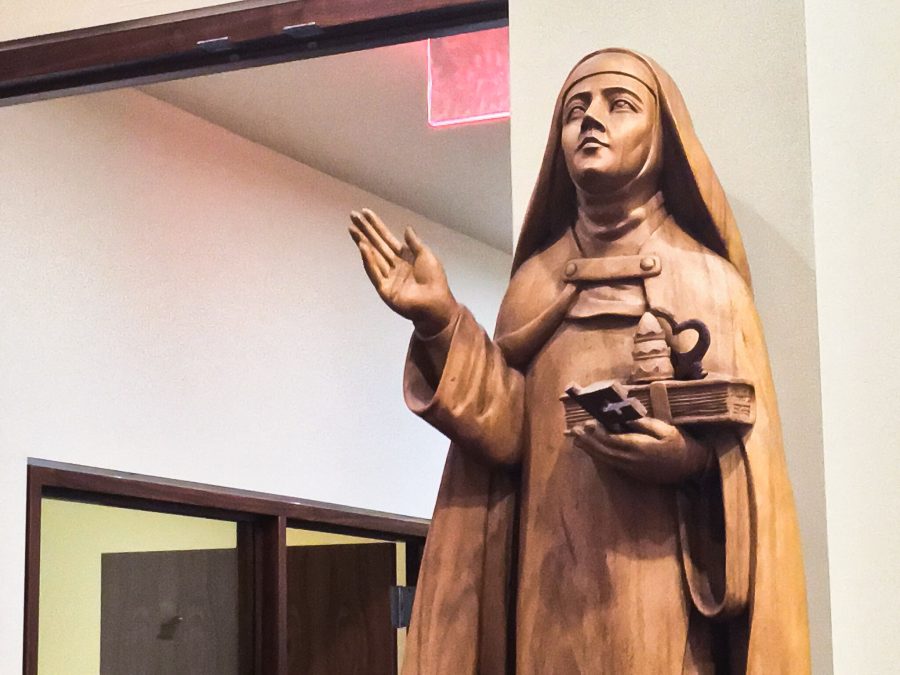 A statue in NYUs Catholic Center observes students as they make their decisions on what to give up for Lent.