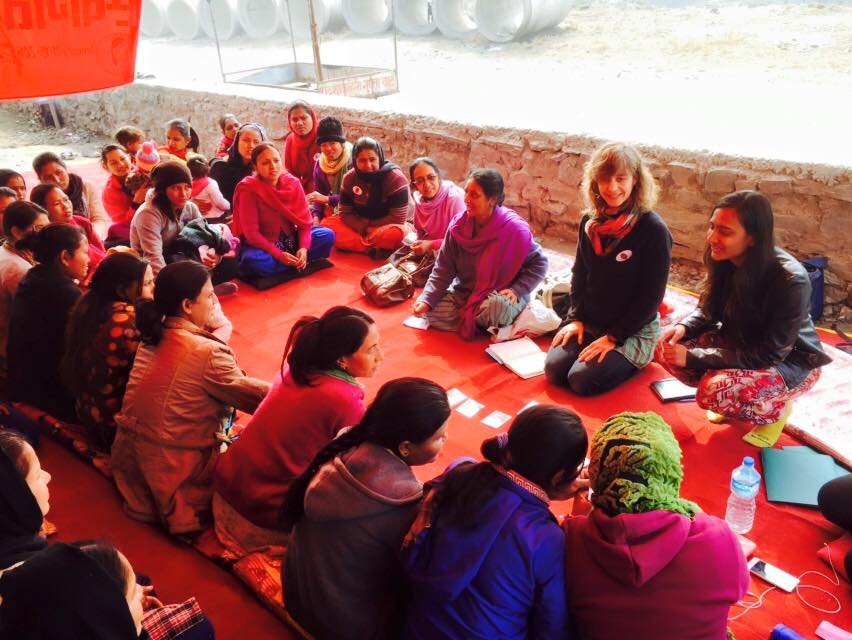 NYU Design for America members meet with local women in Tripureshwor, Nepal, Jan. 2016. The university organisation is collaborating with youth groups in the Nepalese slum to provide comfort to women at night through the use of solar paint.