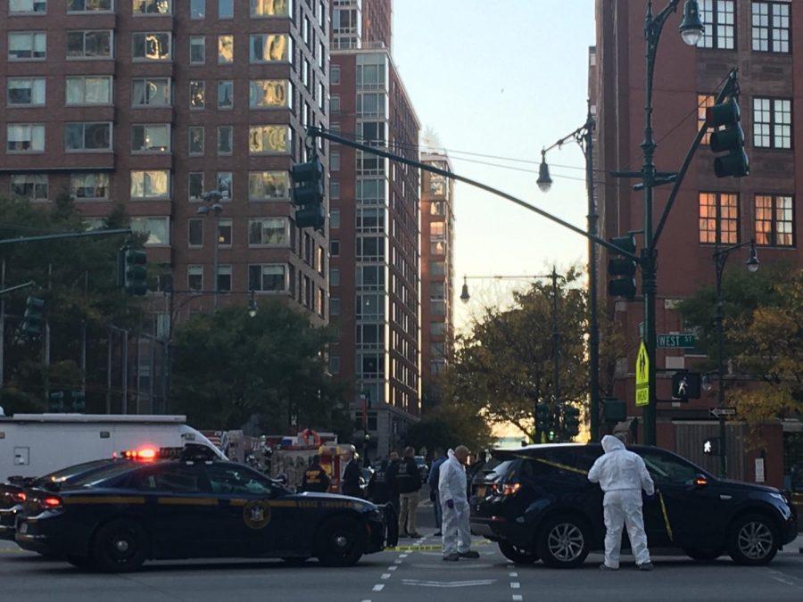 A recent attack on civilians in lower manhattan has left at least eight dead and 11 injured. Forensics and police gather to investigate and control the scene. 
