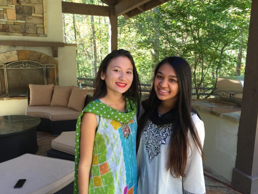 CAS sophomore Natasha Roy (right) and her friend Dani Dudas wear traditional clothing that is commonly worn during Diwali.
