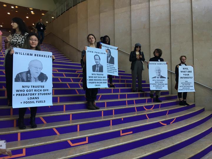 NYU SLAM members made posters outlining how members of the board have ties to other industries that could be deemed a conflict of interest.