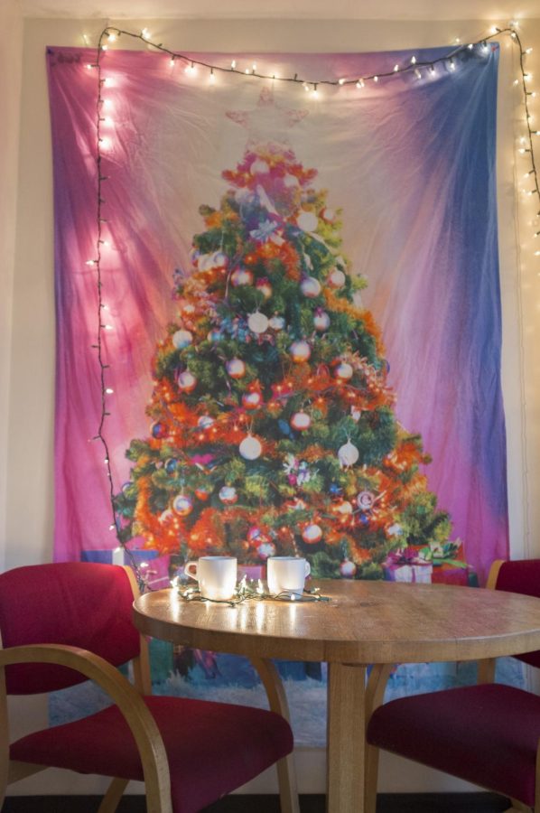 
Festive tapestries are one way to decorate your dorm to celebrate Christmas. 
