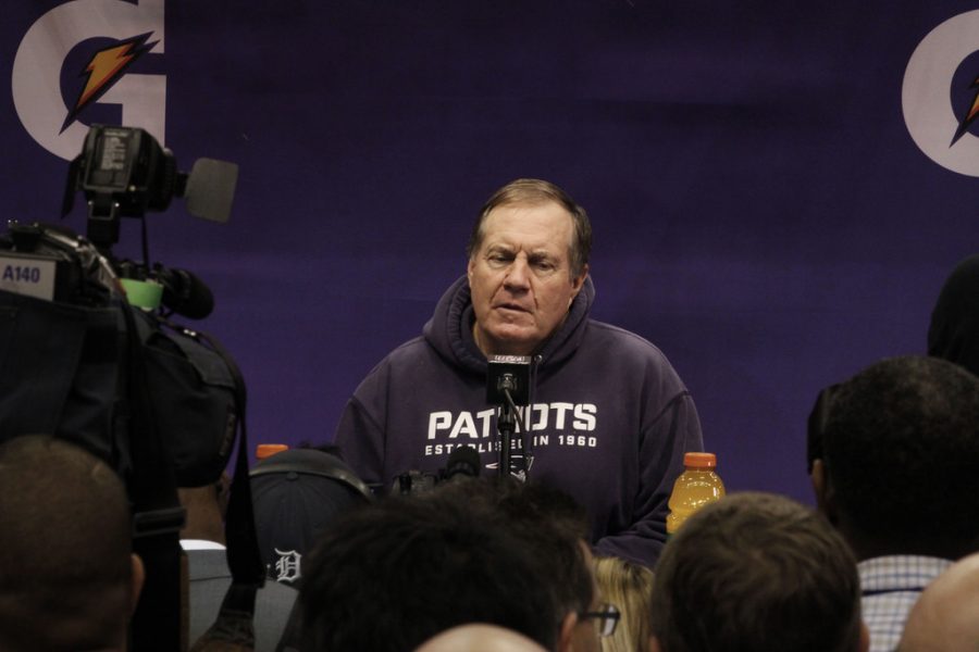 New England Patriots coach Bill Belichick speaking at the podium during Super Bowl XLIX media day, January 2015.
