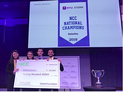 Team members Denitsa Kosharova, Eric Gioseffi, Utkarsh Satyawadi and Kelly Williams accepting $20,000 scholarship following first place win at the MBA Case Competition hosted by Deloitte University. The Stern MBA students earned the school its first victory in the competition. 