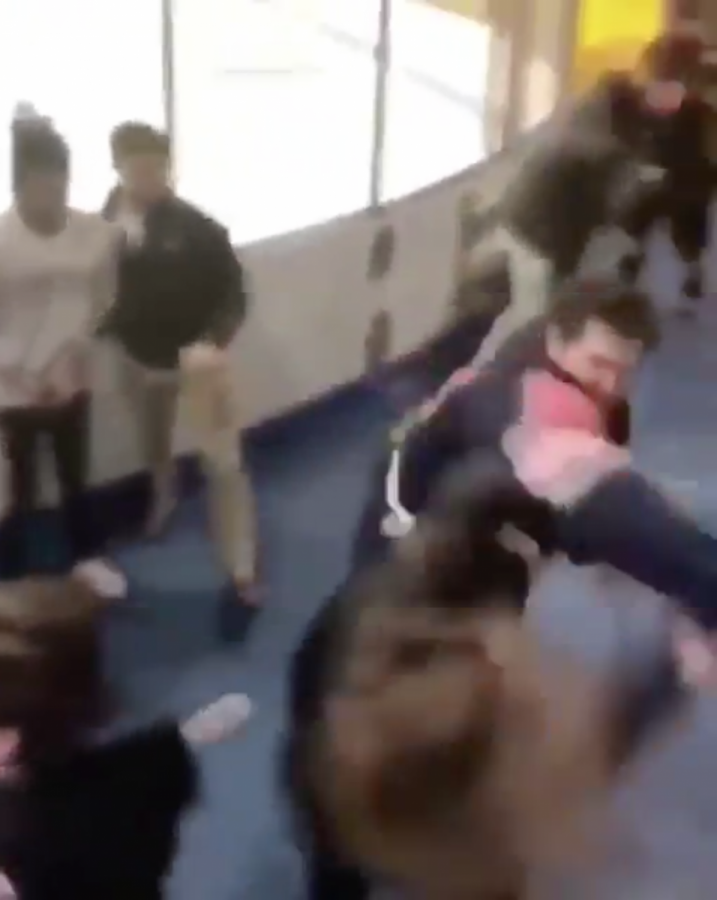 Screenshot from a video taken during the fight. The fight broke out immediately after the game when a fan insulted a Syracuse player. 