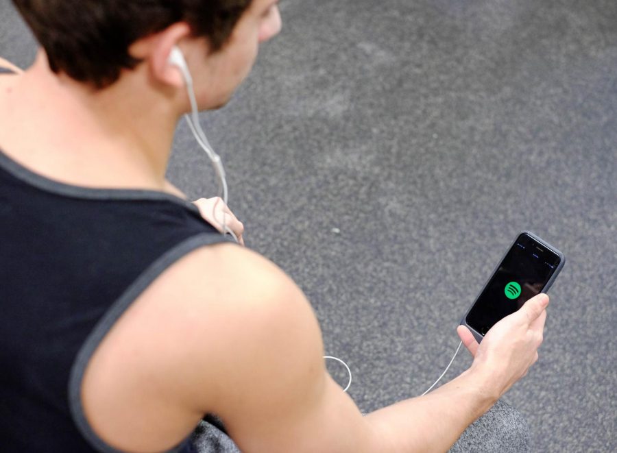 An athlete in the Palladium Athletic Facility opens the Spotify app before a workout.