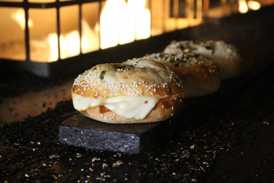 The new Don Angie x Black Seed collaboration bagel, a custom bialy topped and stuffed with green garlic, sesame, and different cheeses. This is part of Black Seed’s ongoing monthly chef collaboration series.