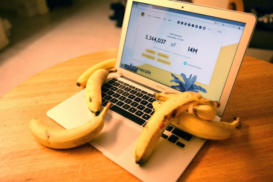 A laptop displaying the Bananacoin homepage.