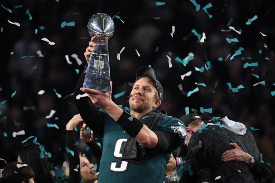 Philadelphia Eagles quarterback Nick Foles holds up the Superbowl trophy after their victory over the New England Patriots on Feb. 4.