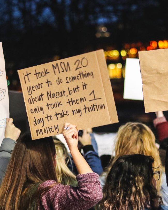 A sign from the Michigan State protest against sexual assault in support of the victims of the Nassar case.