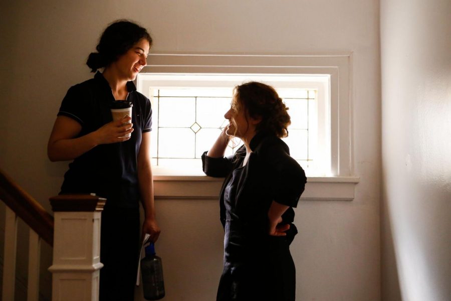 Emma Seligman and Rachel Sennott talking on the set of Shiva Baby.