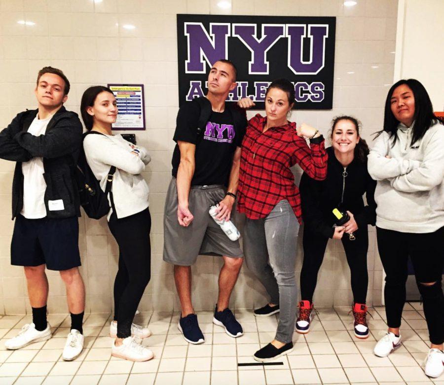 Coach Kayleigh Fournier, NYU’s head strength and conditioning coach, posing with her student trainers.