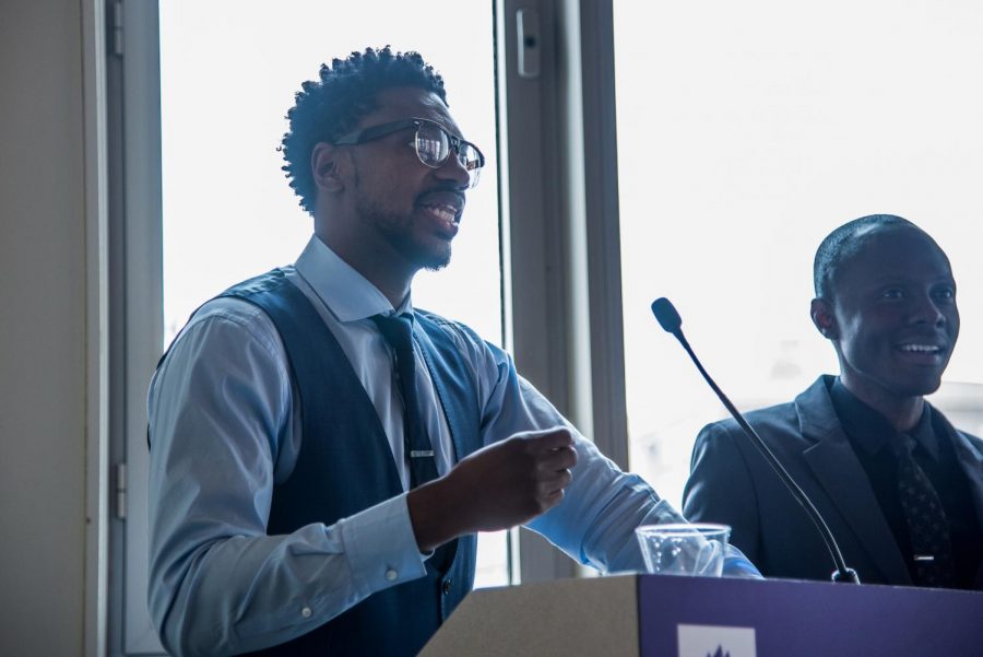 Marcus Johnson, DDS ‘08 (L), and Edly Destine, DDS ‘13, deliver the keynote address at a College of Dentistry brunch on March 4. Johnson started mentoring Destine years ago and they have remained friends since.