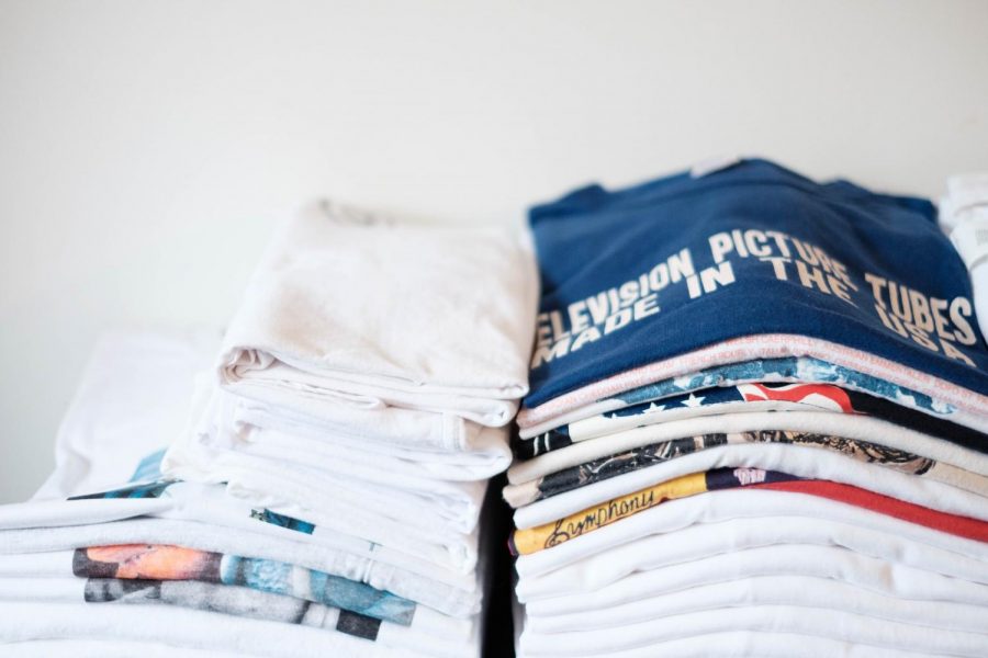 LS freshman Matias Mollin, also known as Matias the Broker on Grailed, has stacks of vintage T-shirts on his bed and ready to be shipped out to his customers.