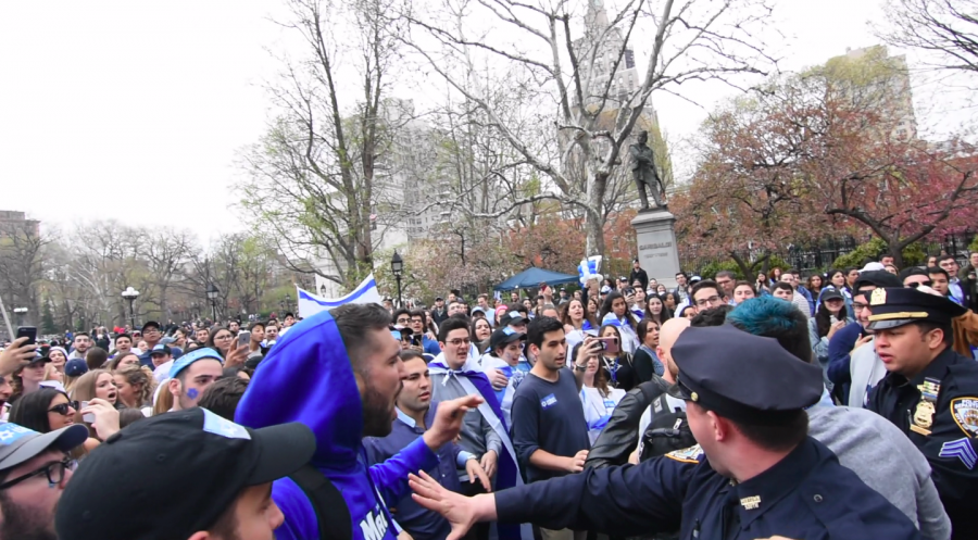 A screenshot from a video of the fight breaking out in Washington Square Park.