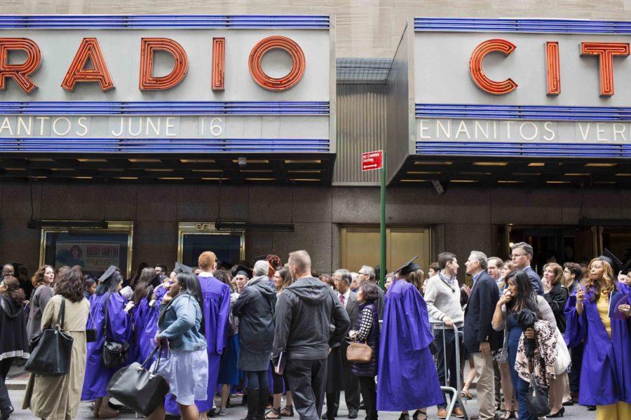 Graduates congregate outside the Radio City Music Hall.