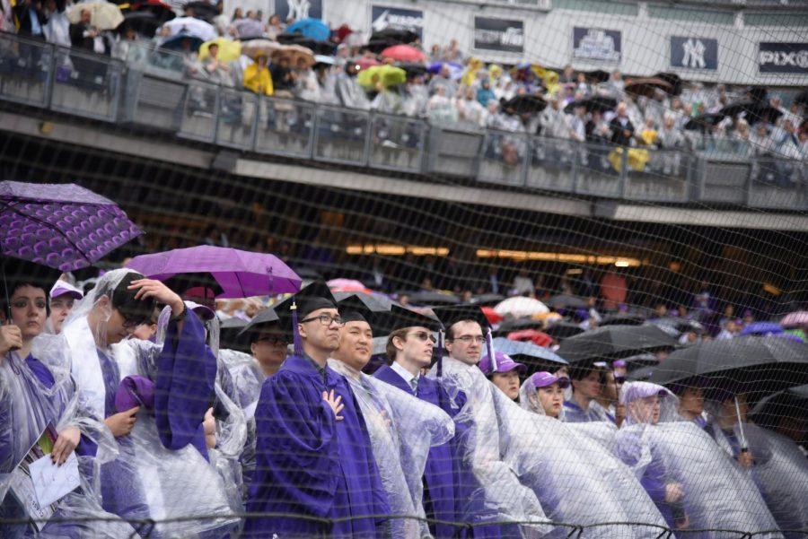 Graduates stand for the National Anthem at last years commencement. (Photo by Renee Yang)