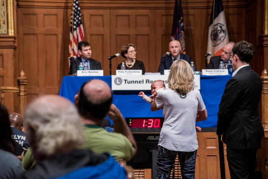 Nolita resident Georgette Fleischer speaks at a town hall meeting about the L Train. It will shut down in April 2019 and remain closed for 15 months.