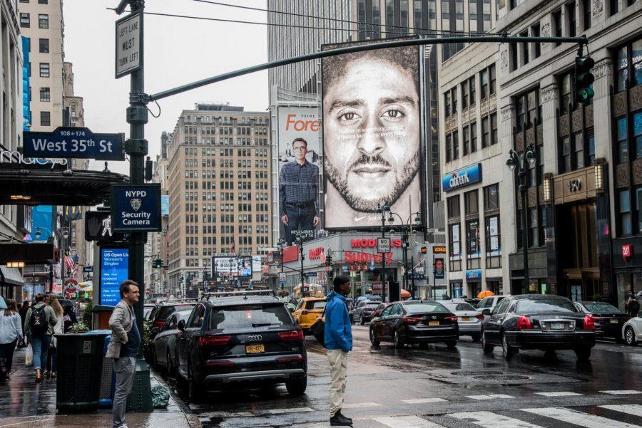 Nike+recently+unveiled+a+new+series+of+advertisements%2C+including+this+billboard+of+Colin+Kaepernick+by+Madison+Square+Garden.+The+text+over+the+image+of+Kaepernick%2C+the+NFL+quarterback+who+started+protesting+police+brutality+in+2016%2C+reads+Believe+in+something.+Even+if+it+means+sacrificing+everything.