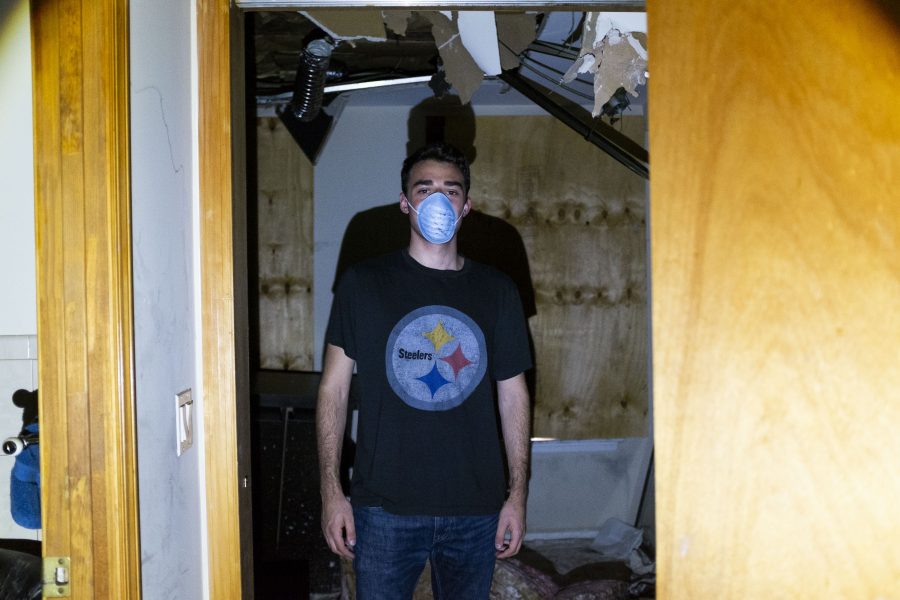Spitzer stands in the doorway of his roommates room. (Photo by Katie Peurrung)