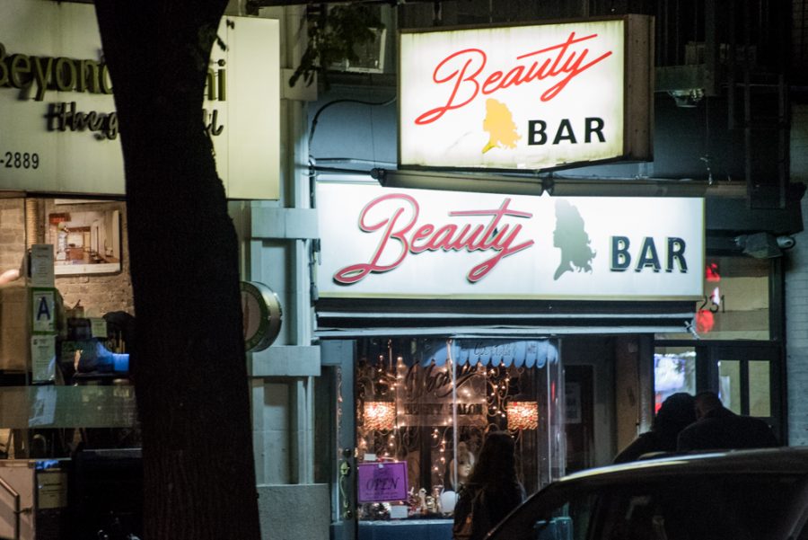 At Beauty Bar on 14th Street, you can get a drink and a manicure – at the same time. (Photo by Sam Klein)